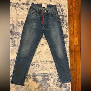 Device denim jeans super cute with red heart on back and red zipper. Size 27